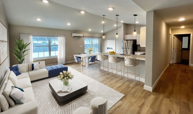 Beautiful living areas to match your lifestyle living room with couch coffee table windows and kitchen in view