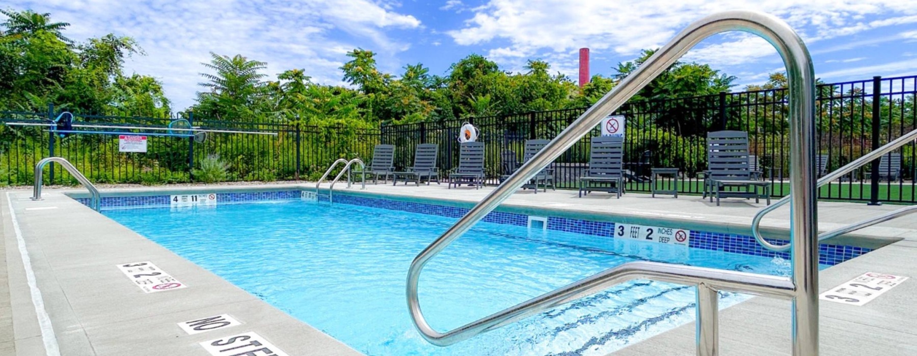 a pool with a city in the background